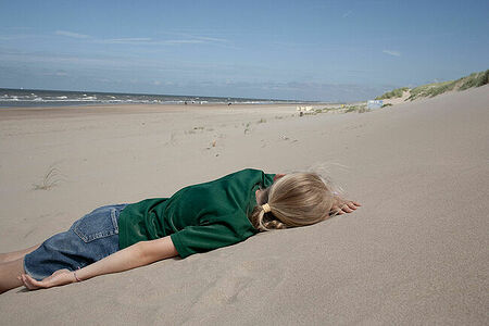 Mariia lying on the sand.  June 2024. Nordwijk. Netherlands.