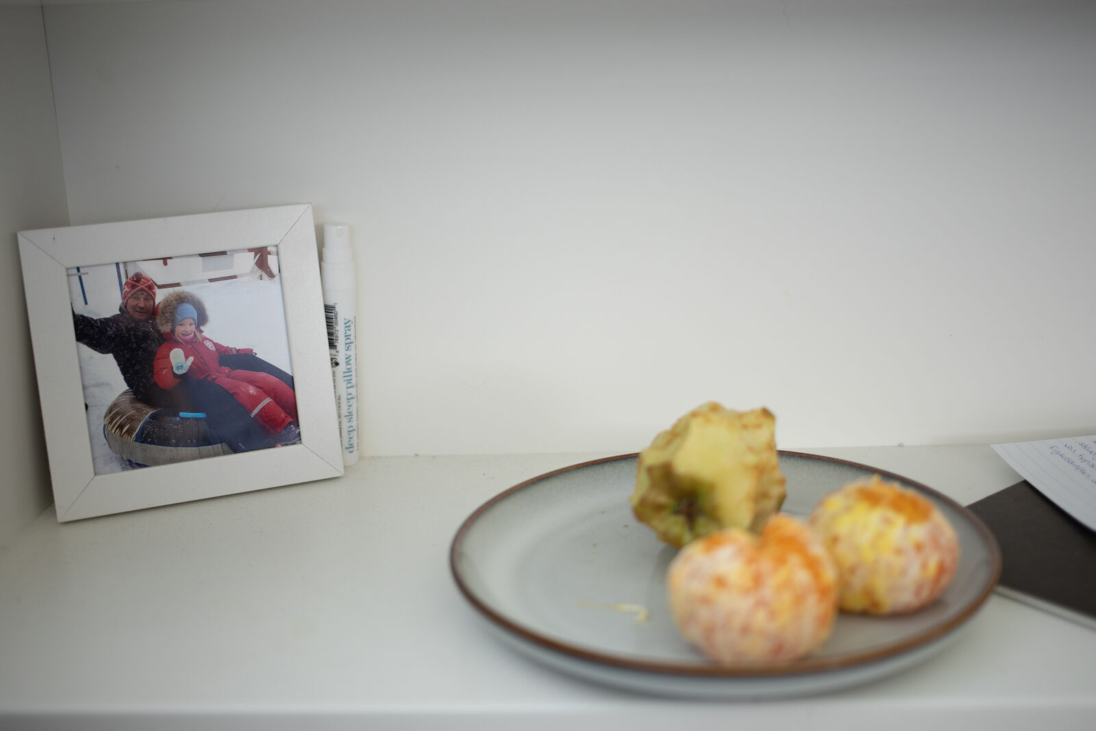 Photo of Masha and her grandfather as a child in her night table. May 2025. Düsseldorf, Germany.